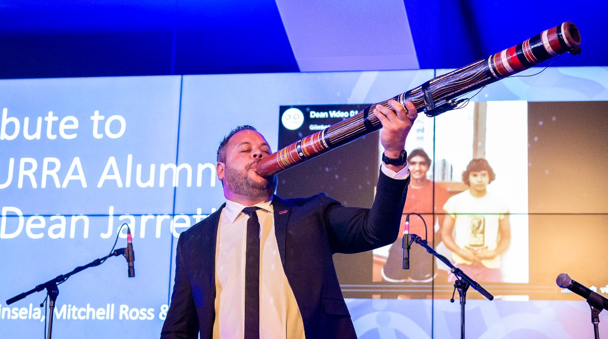 Aboriginal musician and MURRA alumni David Williams plays the didgeridoo in honour of MURRA alumni the late Dr Dean Jarett during the MURRA gala dinner reunion on 10 August 2022.